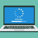 Laptop with a progress bar labelled 'Updating'.