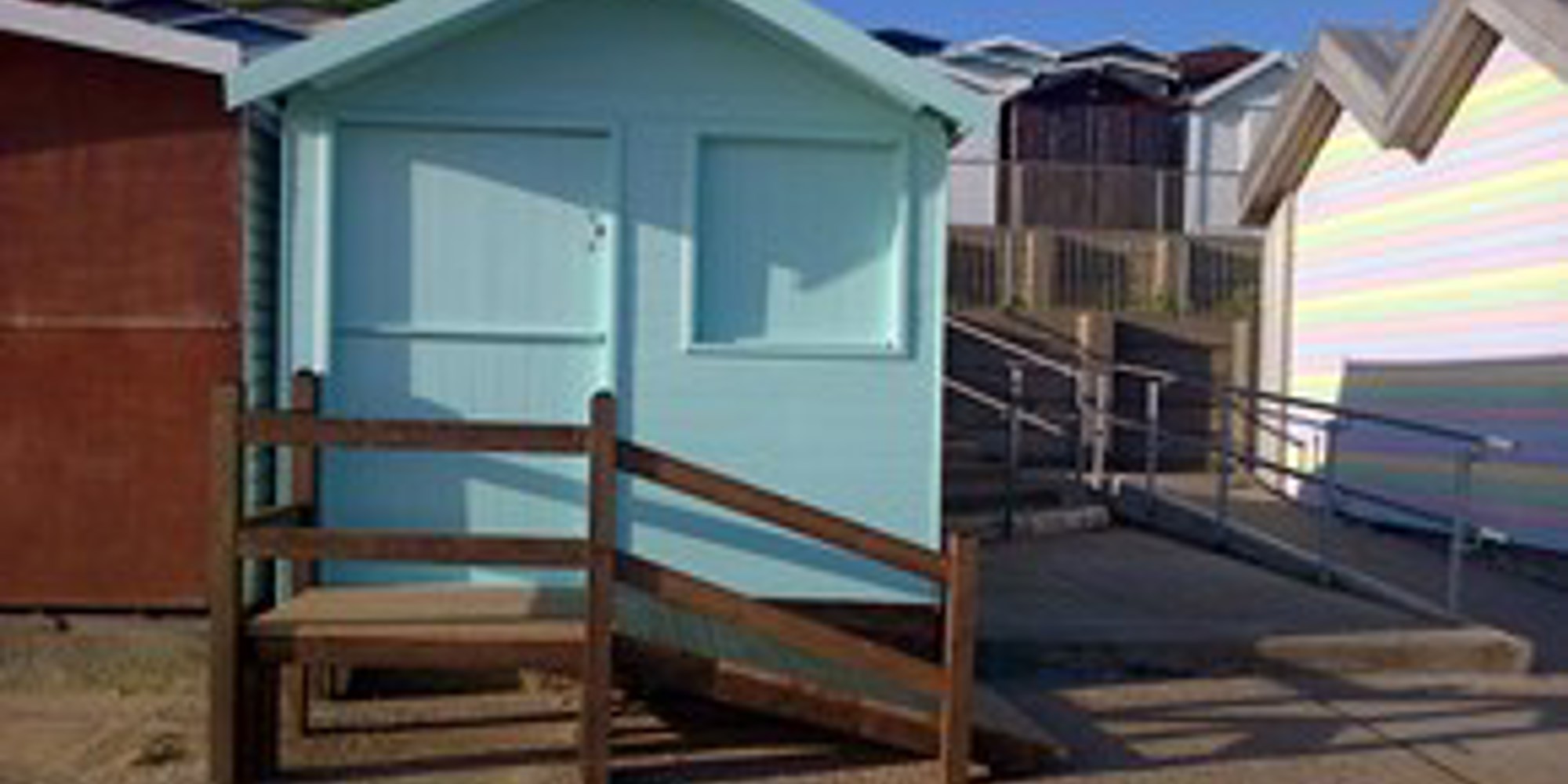 A photo of a blue beach hut