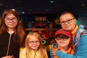 Four young children wearing glasses looking at the camera